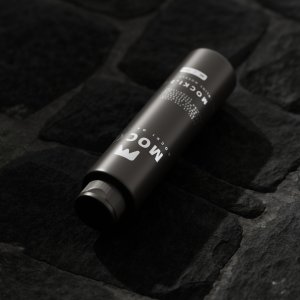 Matte Black Bottle Mockup on Textured Stone