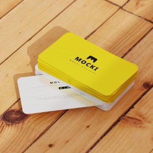 Stacked Business Cards on Wooden Surface Mockup